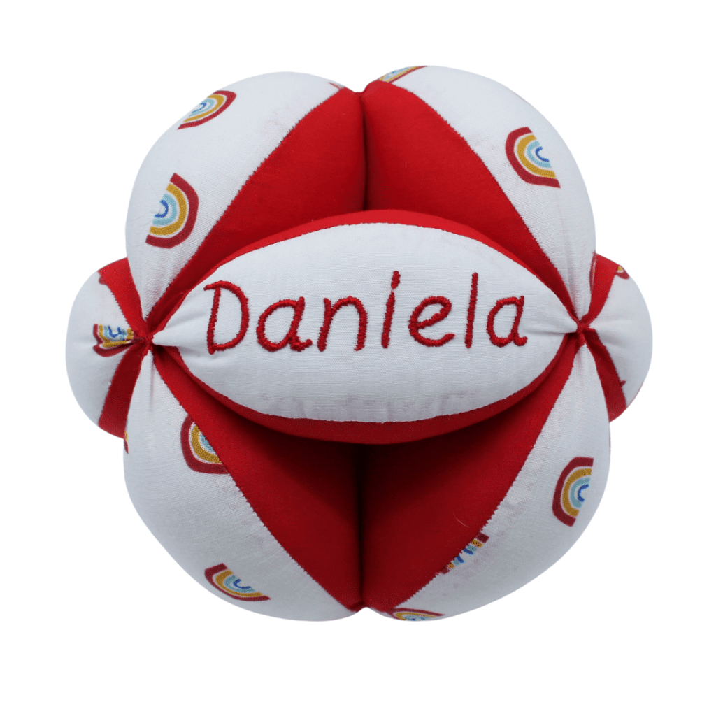 Pelota educativa de tela con textura suave, ideal para el desarrollo motor.