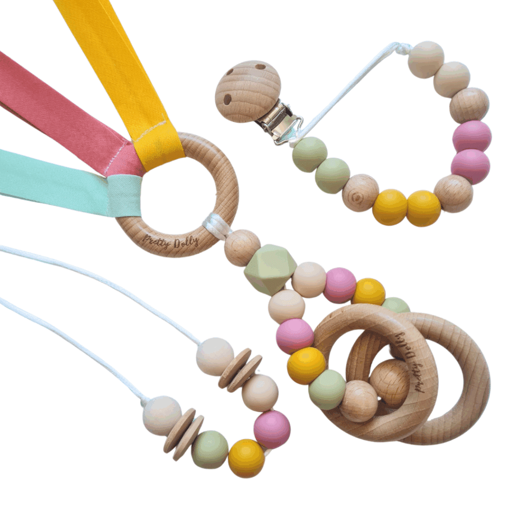 Pack de mordedor, chupetero y collar de lactancia en tonos cálidos con tres texturas sensoriales